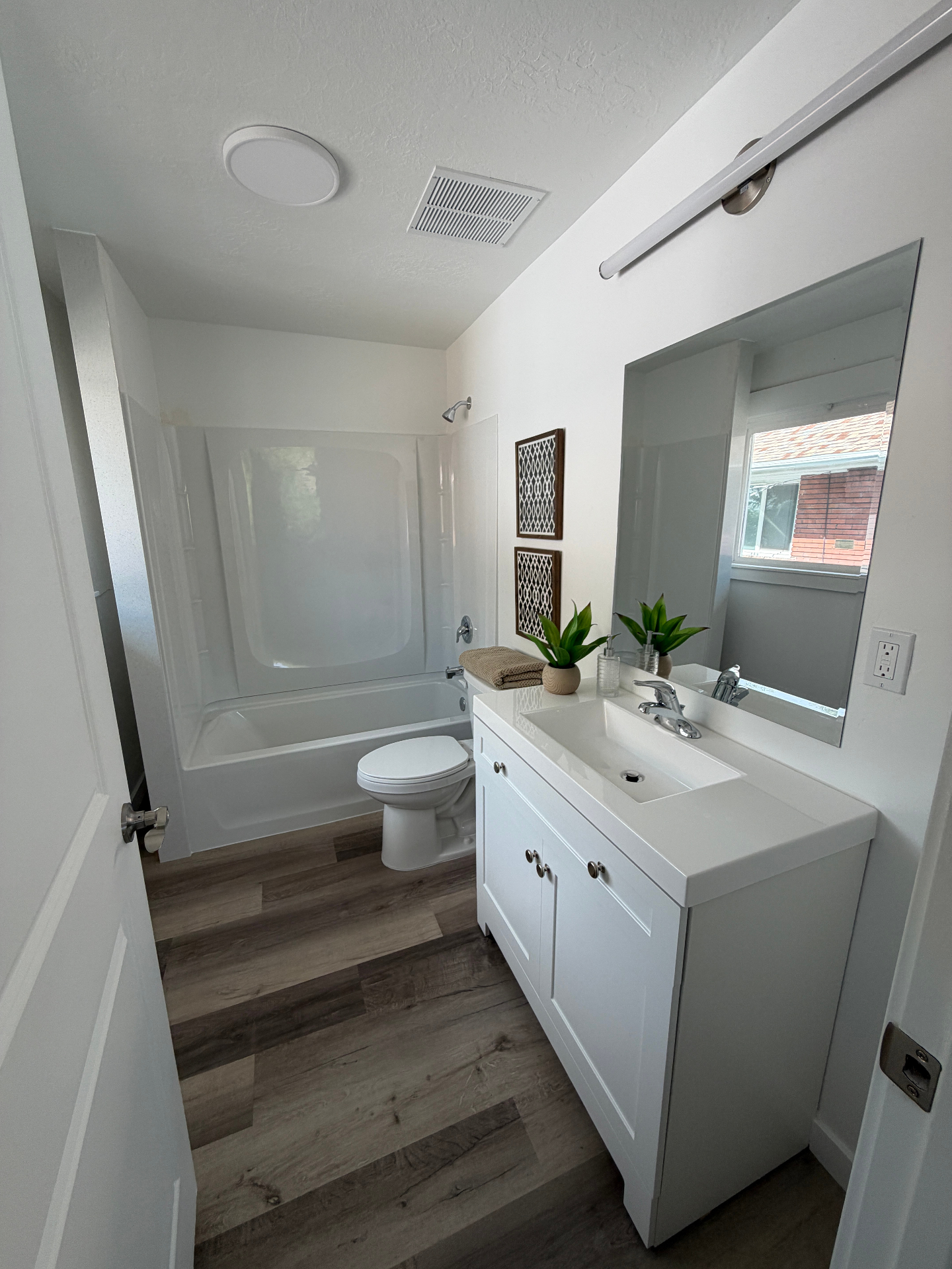 Full bathroom with tub and vanity